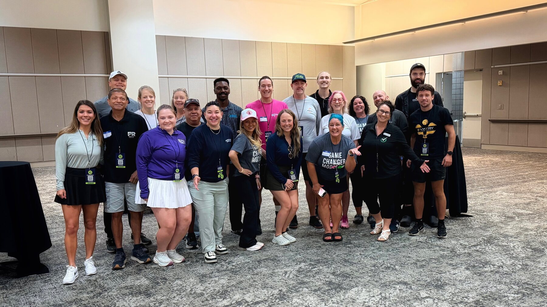 A group of event attendees posing together indoors