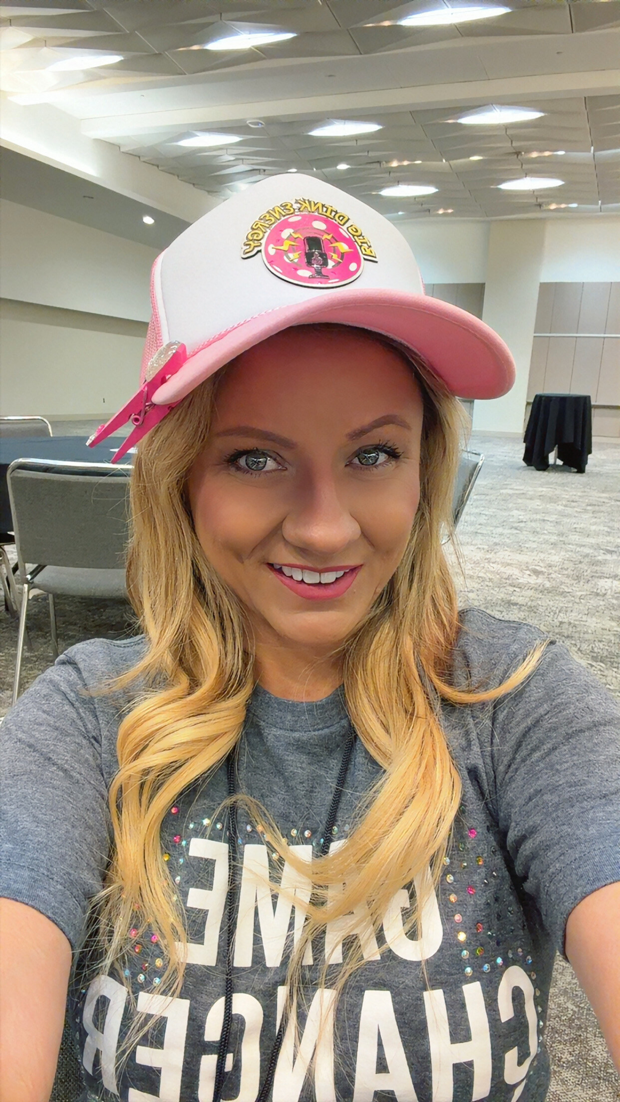 Stefanie Paddle Princess Hoffman smiling in her Big Dink Energy shirt and cap